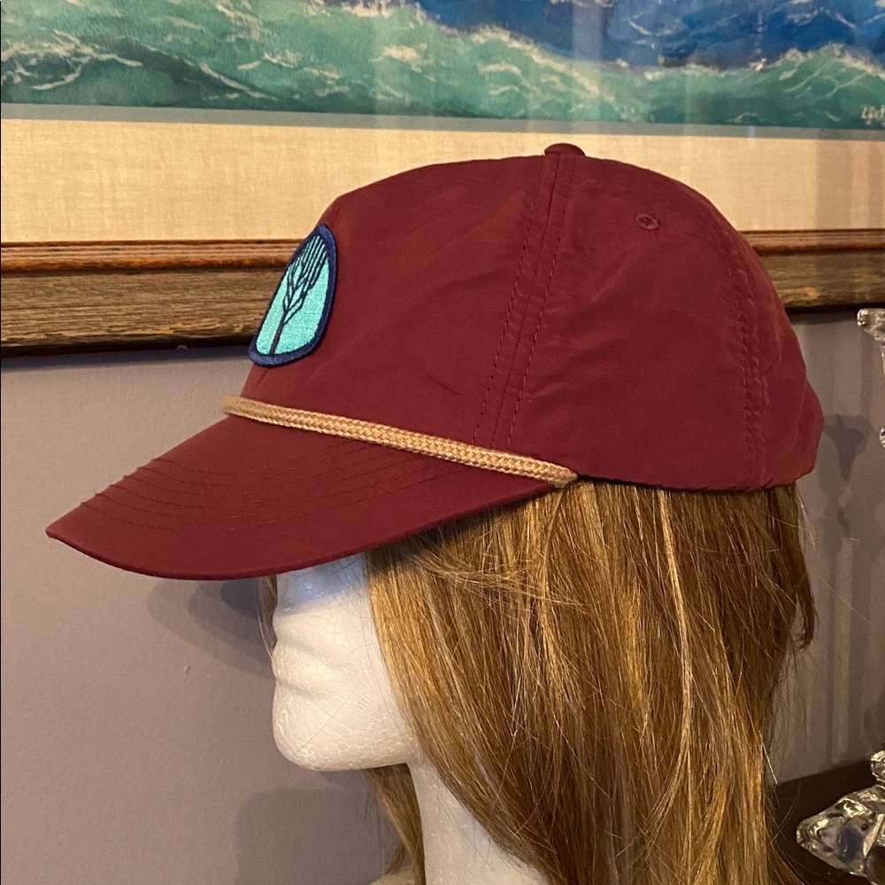 The baseball style cap. It includes a icon patch (the tree logo shown), a rope - Picture 3 of 9